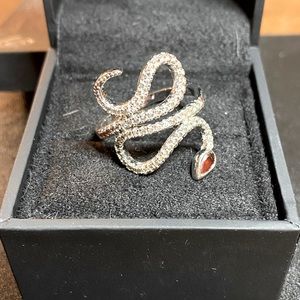 Snake ring with ruby head on silver band with small diamond stones